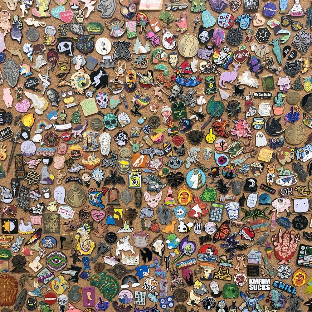 Large collection of colorful custom enamel pins.  Make your own enamel pins