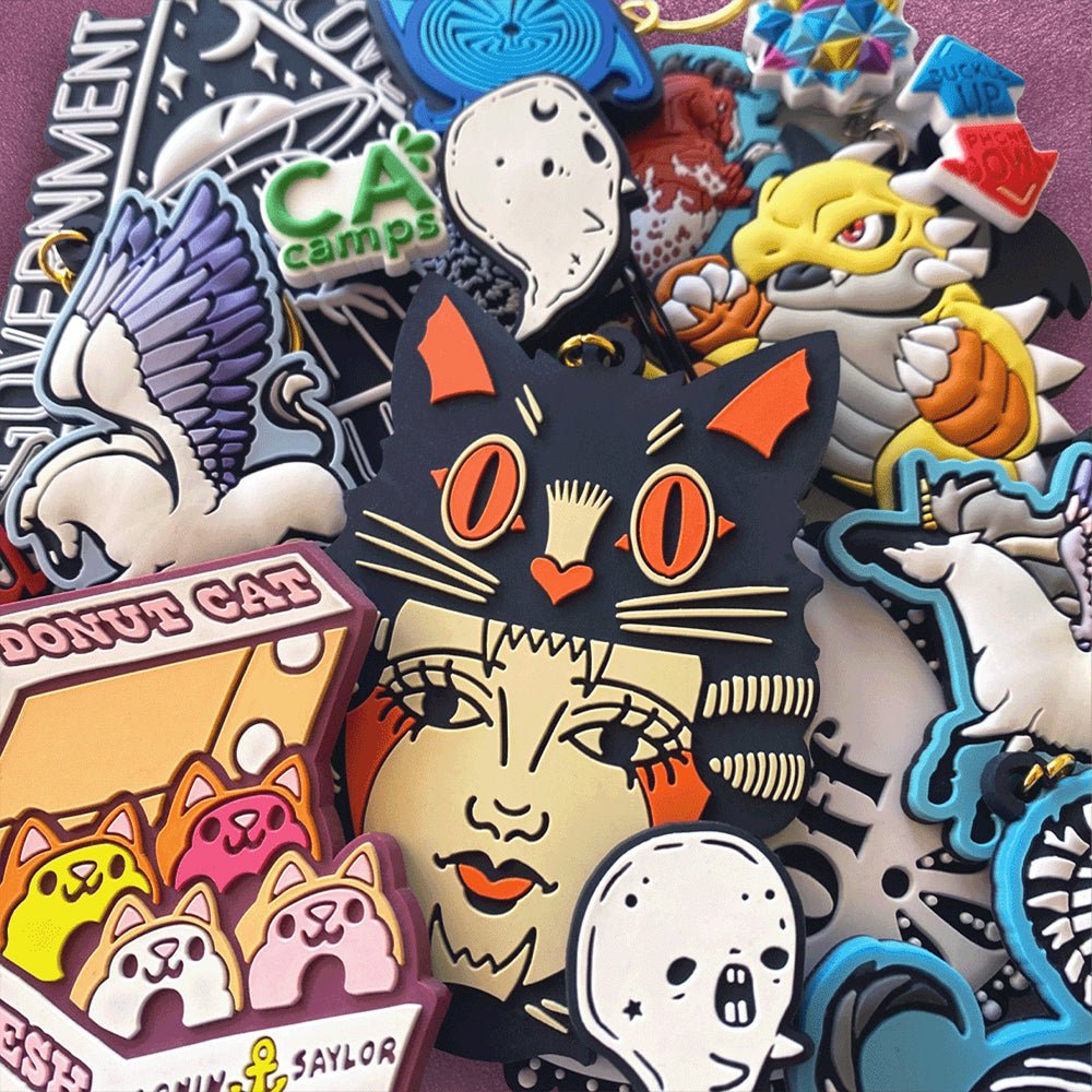 Collection of custom PVC products including colorful shoe charms, keychains and flexible rubber merchandise