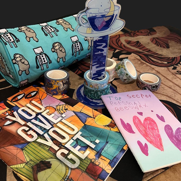Collection of custom stationery including colorful washi tape rolls, pocket notebooks, sticker books and desk accessories
